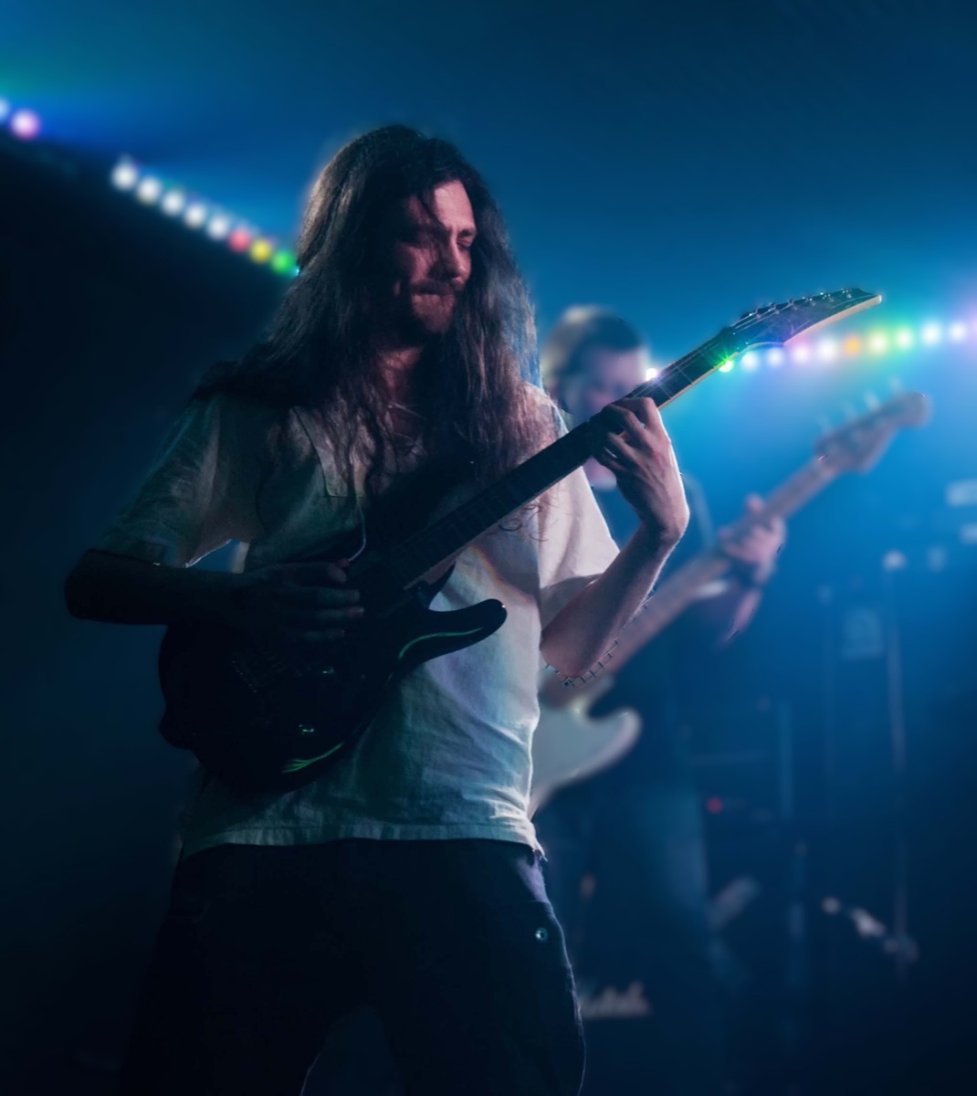 Rodaidh Mackay performing guitar on stage