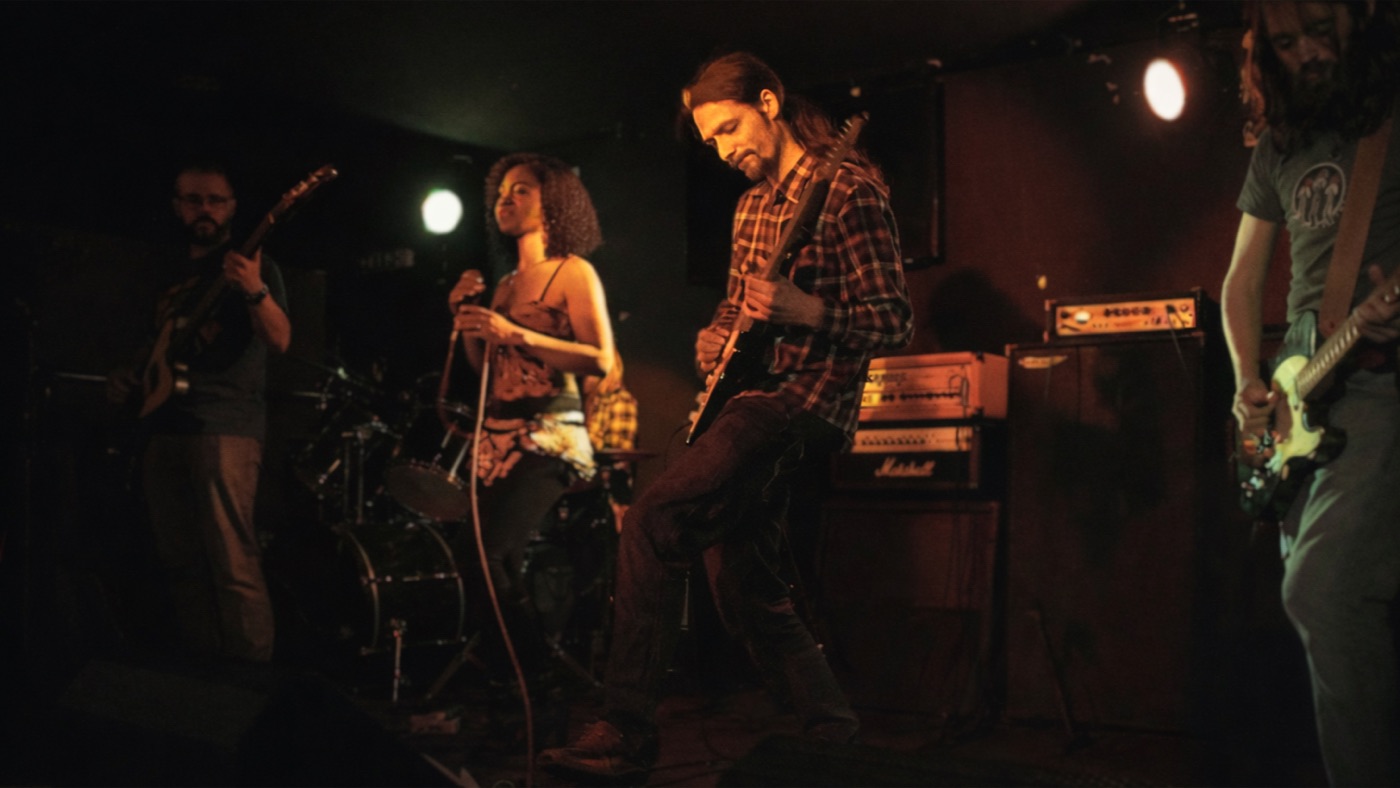 Rodaidh Mackay performing live on guitar